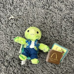 Disney Aulani Resort Olu Mel Keychain Plush Green Turtle Plush with Blue Outfit